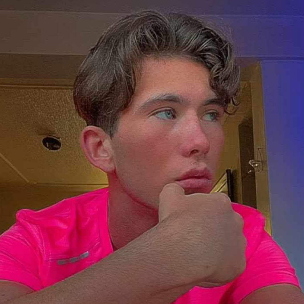 Photo of Cameron in a bright pink top